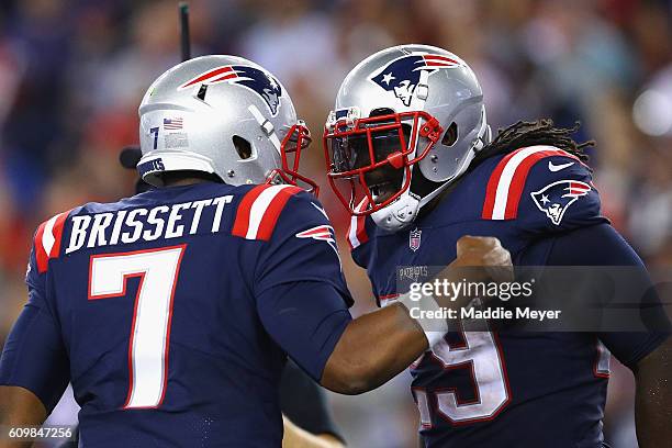 LeGarrette Blount of the New England Patriots celebrates with Jacoby Brissett after scoring a touchdown during the fourth quarter against the Houston...