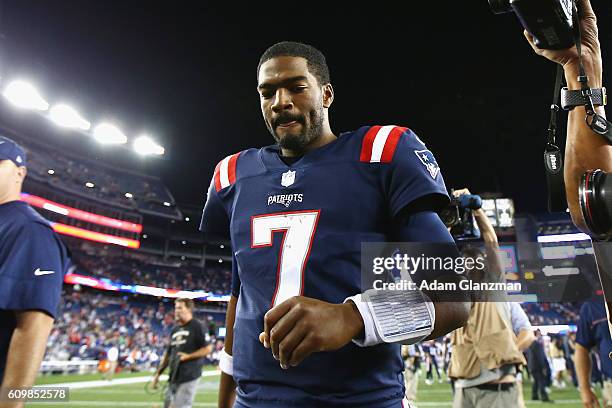 Jacoby Brissett of the New England Patriots runs off the field after defeating the Houston Texans 27-0 at Gillette Stadium on September 22, 2016 in...