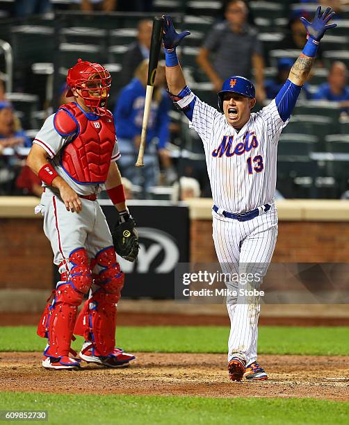 Asdrubal Cabrera of the New York Mets celebrates after hitting a game winning walk-off three run home run in the bottom of the twelfth inning against...