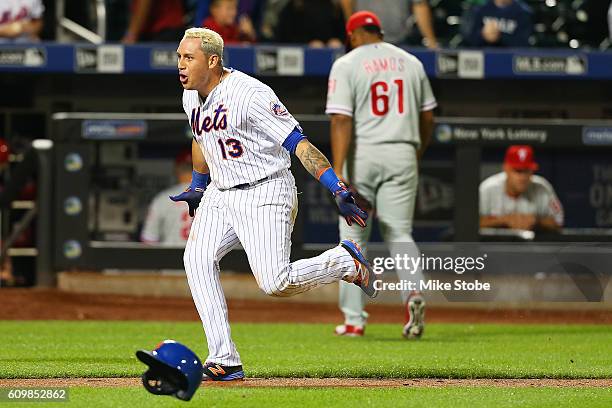 Asdrubal Cabrera of the New York Mets celebrates after hitting a game winning walk-off three run home run in the bottom of the twelfth inning against...