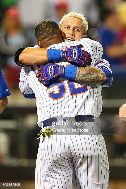 Asdrubal Cabrera of the New York Mets celebrates with Yoenis Cespedes after hitting a game winning walk-off three run home run in the bottom of the...