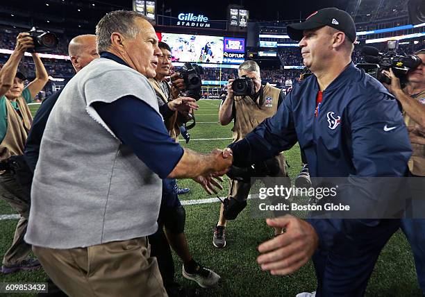 New England Patriots head coach Bill Belichick, left, and Houston Texans head coach Bill O'Brien shake hands after New England's victory at Gillette...