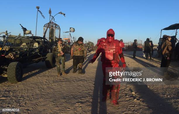 Festival goers attend the first day of Wasteland Weekend in the high desert community of California City in the Mojave Desert, California, where...