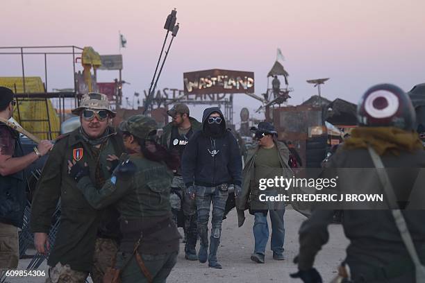 Festival goers attend the first day of Wasteland Weekend in the high desert community of California City in the Mojave Desert, California, where...