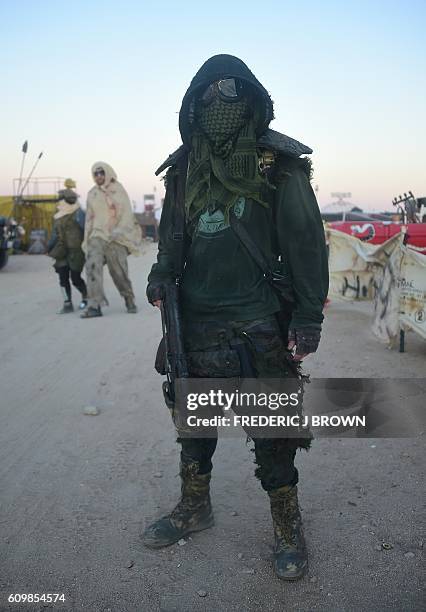 Festival goers, including Brodie Grbcich seen here in costume, attend the first day of Wasteland Weekend in the high desert community of California...