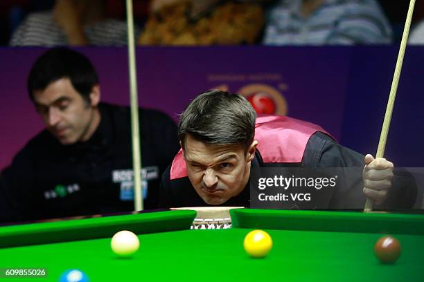 Michael Holt of England eyes the ball in the second round match against Ronnie O'Sullivan of England on day four of the Shanghai Masters 2016 at...