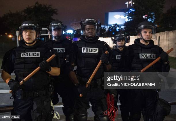 Riot police block off a ramp to a highway during a demonstration against police brutality in Charlotte, North Carolina, on September 22, 2016...