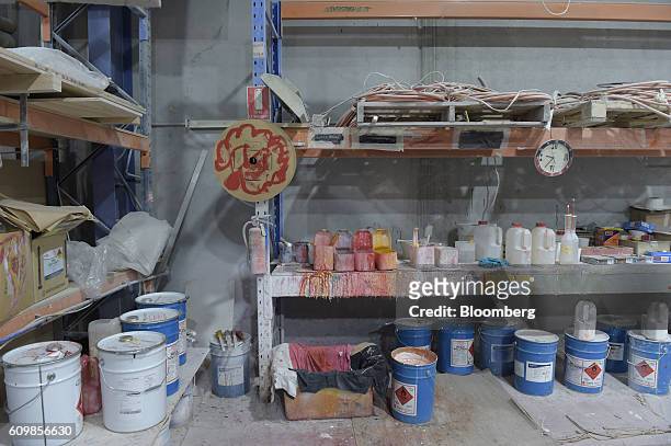 Cans, containers and tools sit on shelves and the ground at a King's Fiberglass Pty. Ltd. Facility in Melbourne, Australia, on Wednesday, Aug. 17,...