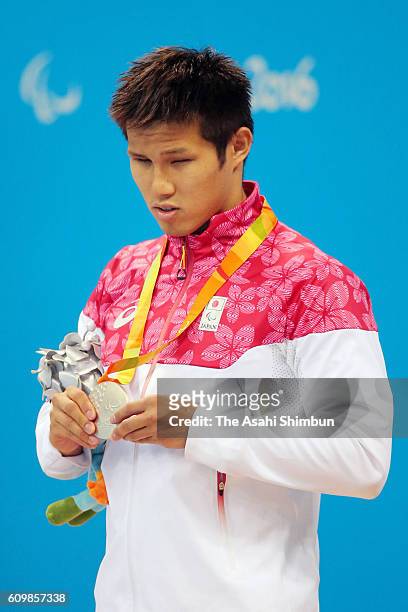 Silver medalist Keiichi Kimura of Japan celebrates on the podium at the medal ceremony for the Men's 50m Freestyle - S11 duirng day 5 of the 2016 Rio...