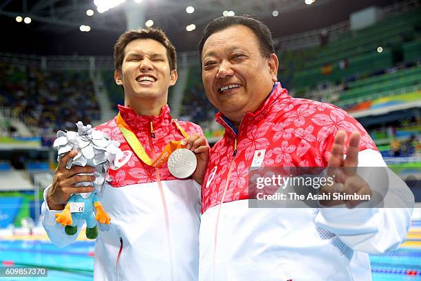 Silver medalist Keiichi Kimura of Japan celebrateswith his coach Masato Teranishi after the medal ceremony for the Men's 50m Freestyle - S11 duirng...