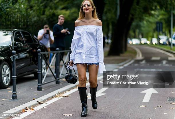 Chiara Ferragni wearing Frankie camicia , shorts levis , chanel boots, bag loewe outside Pucci during Milan Fashion Week Spring/Summer 2017 on...