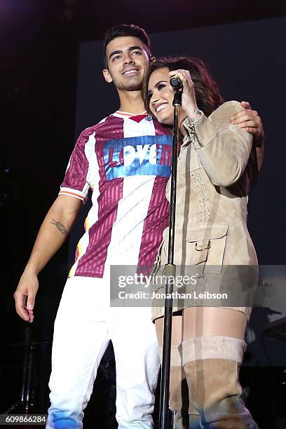 Recording artists Joe Jonas of DNCE and Demi Lovato perform onstage during the Demi Lovato and DNCE Concert for Marriott Rewards members at JW...