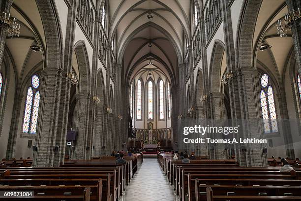 inside the myeongdong cathedral in seoul - brick cathedral stock pictures, royalty-free photos & images