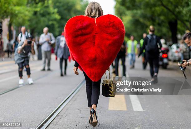 Erica Pelosini wearing a heart jacket outside Fendi during Milan Fashion Week Spring/Summer 2017 on September 22, 2016 in Milan, Italy.