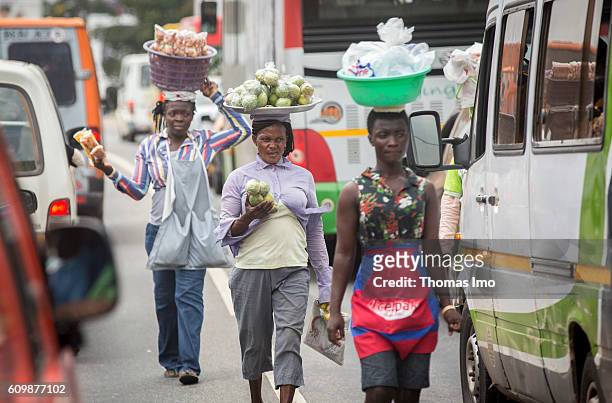 Accra, Ghana African women transport food on their heads on September 05, 2016 in Accra, Ghana. Street scene in Ghana's capital Accra.
