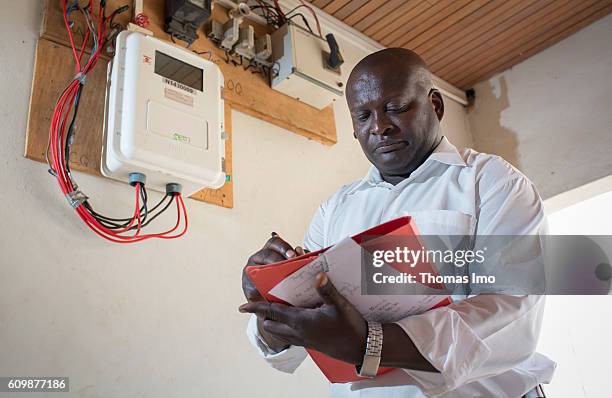 Accra, Ghana An African man is reading the meter of a solar collector on September 05, 2016 in Accra, Ghana.