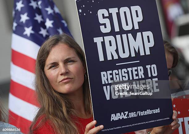 An activist protesting against Republican U.S. Elections candidate Donald Trump attends an event to urge U.S. Citizens abroad to vote at the...
