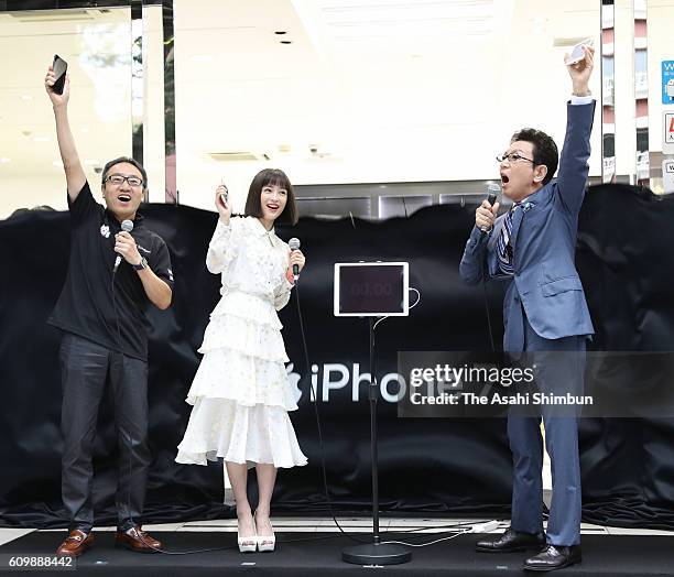 SoftBank President Ken Miyauchi, actress Suzu Hirose and tv presenter Ichiro Furudachi attend the iPhone 7 launch event on September 16, 2016 in...