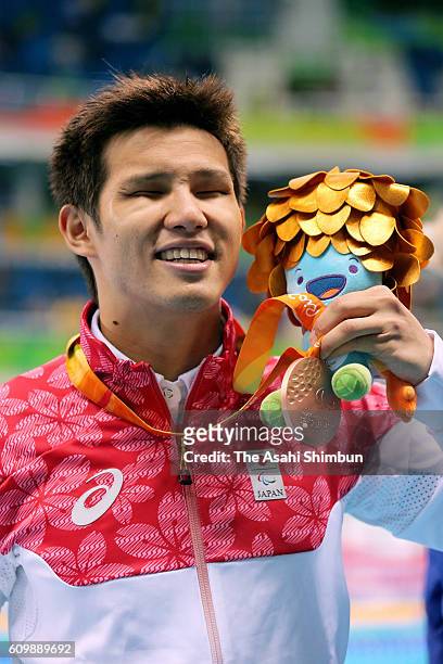 Bronze medalist Keiichi Kimura of Japan celebrates after the medal ceremony for the Men's 100m Freestyle - S11 on day 8 of the 2016 Rio Paralympic...