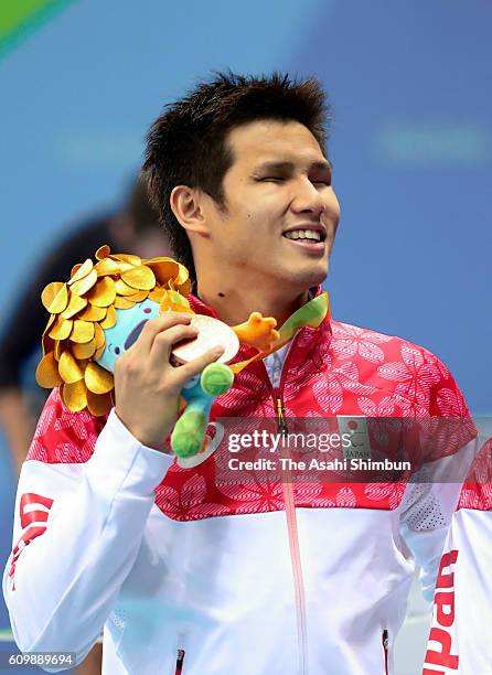 Bronze medalist Keiichi Kimura of Japan celebrates after the medal ceremony for the Men's 100m Freestyle - S11 on day 8 of the 2016 Rio Paralympic...