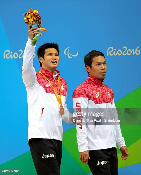 Bronze medalist Keiichi Kimura of Japan celebrates on the podium at the medal ceremony for the Men's 100m Freestyle - S11 on day 8 of the 2016 Rio...