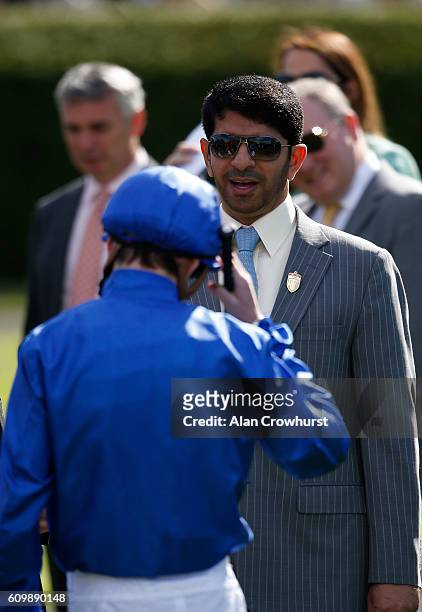 Jockey James Doyle greets trainer Saeed bin Suroor at Newmarket Racecourse on September 23, 2016 in Newmarket, England.