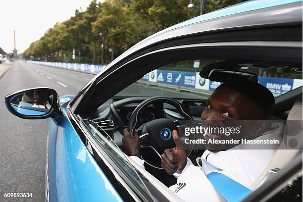 Former world record holder Wilson Kipsang of Kenya, top favorites of the 43. BMW Berlin Marathon 2016 drives a BMW i8 at the Siegessaeule on...