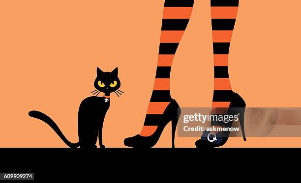 black cat and witch's legs - black cat witch stock illustrations