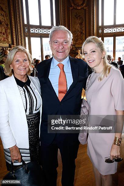 Alain Flammarion standing between his wife Suzanna and Wife of Italy's Ambassador to France, Giada Magliano attend Cyril Karaoglan receives the Medal...