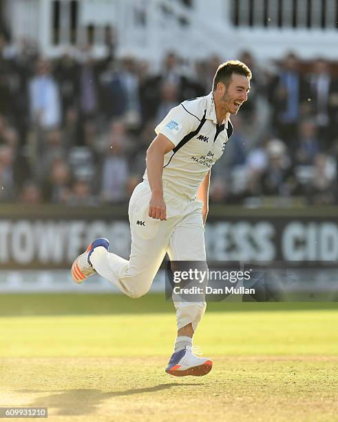 Toby Roland-Jones of Middlesex celebrates taking the wicket of Ryan Sidebottom of Yorkshire to win the match during day four of the Specsavers County...