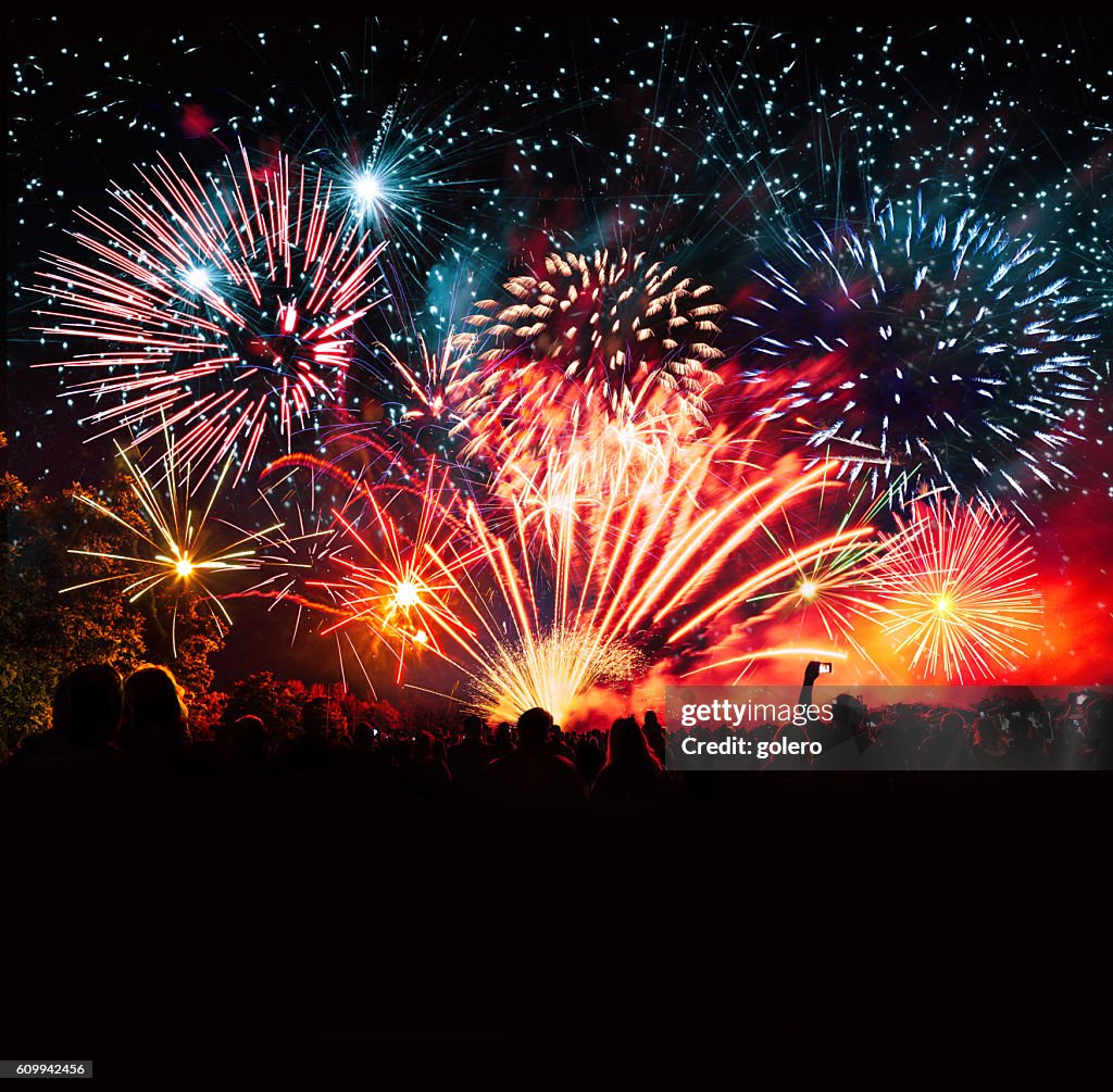 Vibrant new years banner with fireworks and cheering crowd