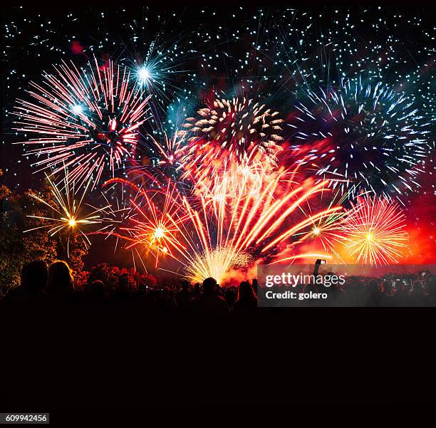 vibrant new years banner with  fireworks and cheering crowd - firework display stock pictures, royalty-free photos & images