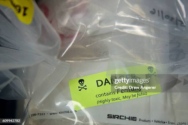 Bags of heroin, some laced with fentanyl, are displayed before a press conference regarding a major drug bust, at the office of the New York Attorney...