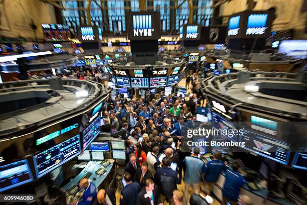 Traders work on the floor of the New York Stock Exchange in New York, U.S., on Friday, Sept. 23, 2016. U.S. Stocks slipped as investors considered...