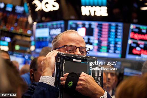 Trader works on the floor of the New York Stock Exchange in New York, U.S., on Friday, Sept. 23, 2016. U.S. Stocks slipped as investors considered...