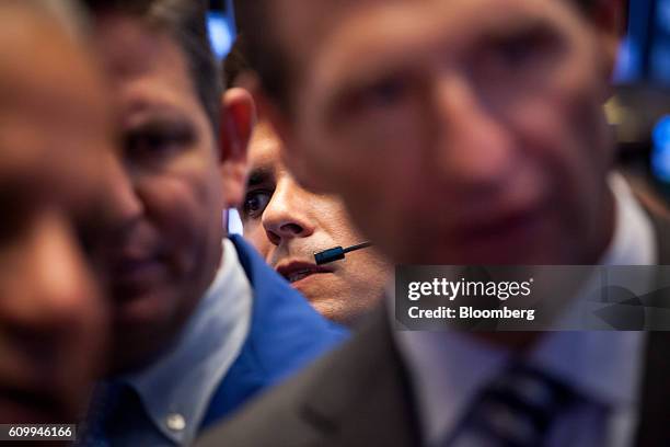 Traders work on the floor of the New York Stock Exchange in New York, U.S., on Friday, Sept. 23, 2016. U.S. Stocks slipped as investors considered...