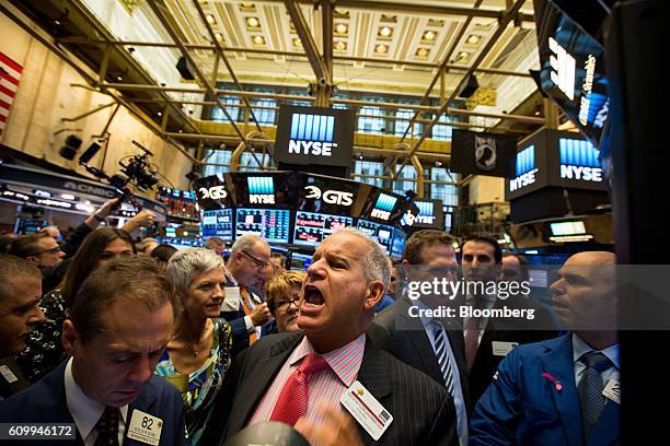 Traders work on the floor of the New York Stock Exchange in New York, U.S., on Friday, Sept. 23, 2016. U.S. Stocks slipped as investors considered...