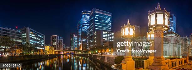 neon night futuristic cityscape panorama illuminated lamplight osaka japan - kinki stockfoto's en -beelden