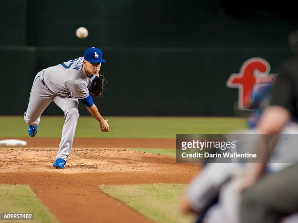 Jose De Leon of the Los Angeles Dodgers warms up in the first inning of the MLB game against the Arizona Diamondbacks at Chase Field on September 18,...