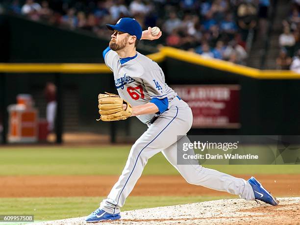 Relief pitcher Louis Coleman of the Los Angeles Dodgers throws a pitch in the eighth inning of the MLB game against the Arizona Diamondbacks at Chase...