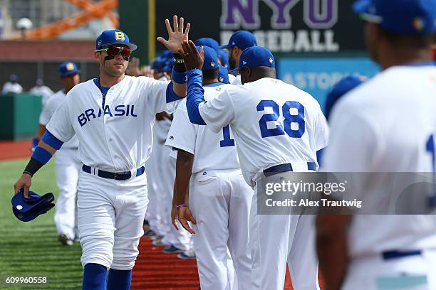 Dante Bichette Jr. #19 of Team Brazil is greeted by teammates during player introductions prior to Game 3 of the 2016 World Baseball Classic...