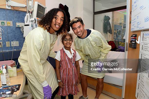 New England Revolution player Zachary Herivaux and Lee Nguyen visit Vaidehi at Boston Children's Hospital September 21, 2016 in Boston, Massachusetts.