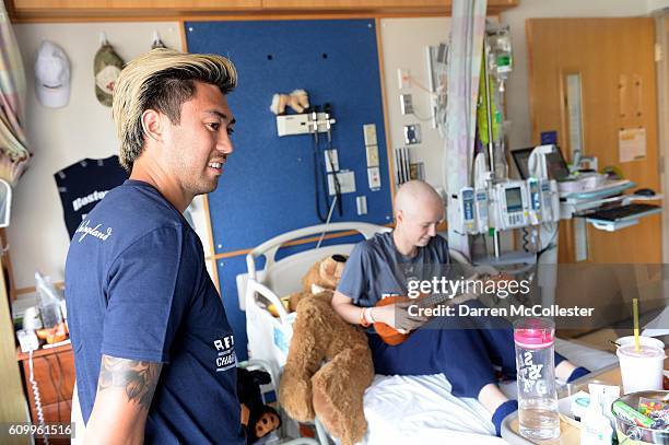 New England Revolution players Lee Nguyen visits Samantha at Boston Children's Hospital September 21, 2016 in Boston, Massachusetts.