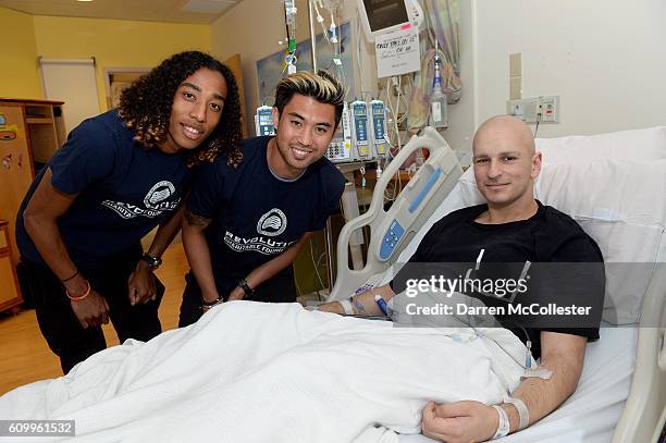 New England Revolution players Zachary Herivaux and Lee Nguyen visit Reda at Boston Children's Hospital September 21, 2016 in Boston, Massachusetts.