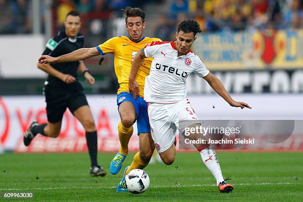 Patrick Schoenfeld of Braunschweig challenges Kaan Ayhan of Duesseldorf during the Second Bundesliga match between Eintracht Braunschweig and Fortuna...