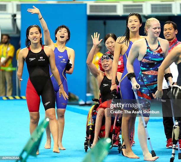 Mayumi Narita Mei Ichinose , Yuki Morishita and Airi Ike of Japan wave after competing in the Women's 4x100m Medley Relay - 34 Points Final on day 9...