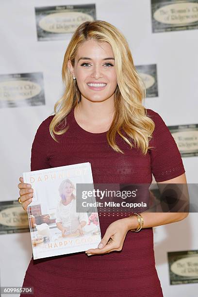 Author/Television personality Daphne Oz signs copies of her new book "The Happy Cook" at Women's Club Of Ridgewood on September 23, 2016 in...