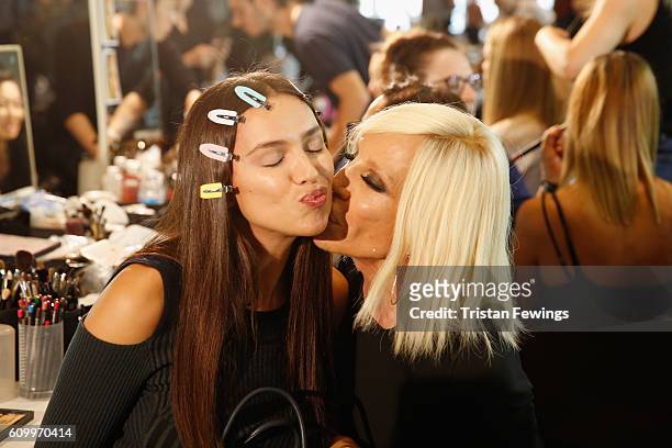 Model Irina Shayk and designer Donatella Versace are seen backstage ahead of the Versace show during Milan Fashion Week Spring/Summer 2017 on...