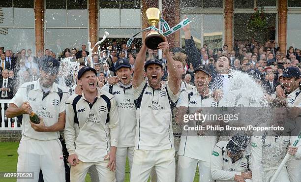 James Franklin lifts the trophy after Middlesex won the county championship on day four of the Specsavers County Championship Division One cricket...