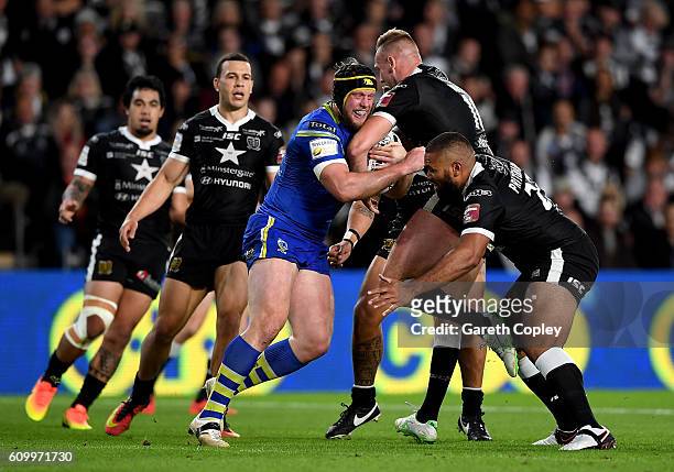 Chris Hill of Warrington is tackled by Liam Watts and Frank Pritchard of Hull during the First Utility Super League match between Hull FC and...